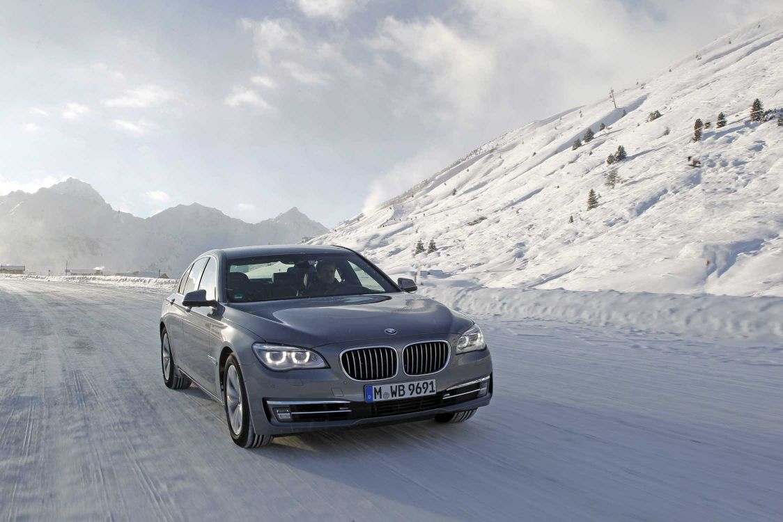 black bmw car on road during daytime