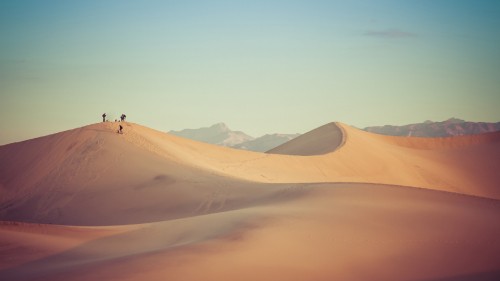 Image people walking on desert during daytime