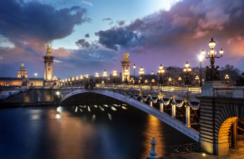 Image bridge over water during night time