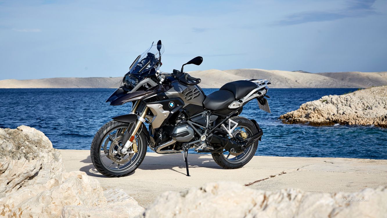 black and gray motorcycle on beach during daytime