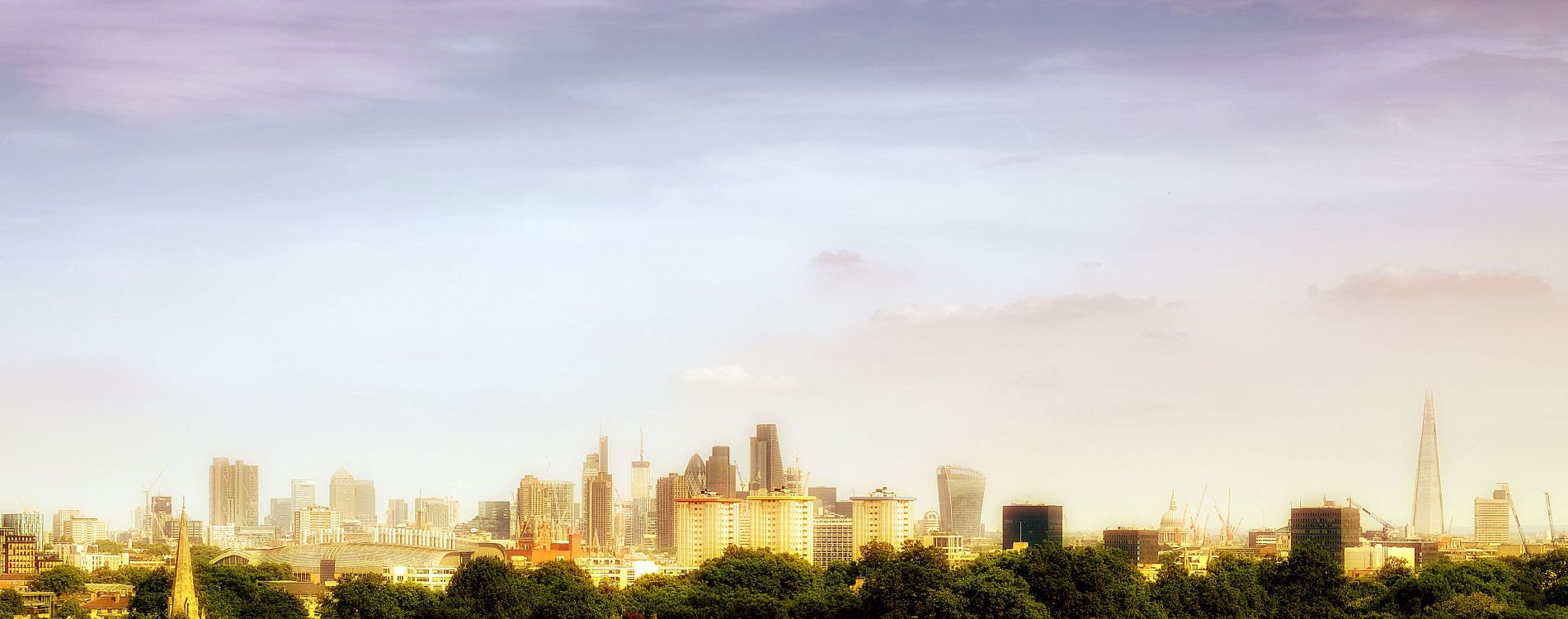 city buildings under white sky during daytime