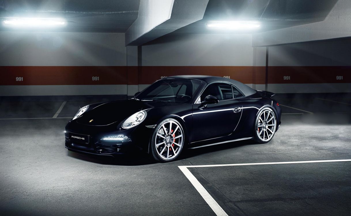 black porsche 911 parked in building