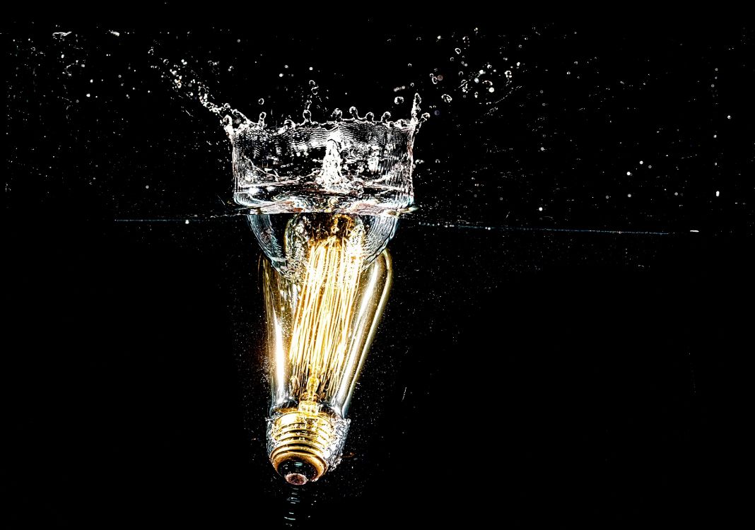 gold water fountain in black background