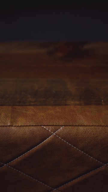 Image brown leather textile on brown wooden table