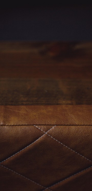 Image brown leather textile on brown wooden table