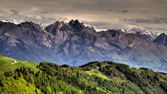 Image green and brown mountains under white clouds during daytime