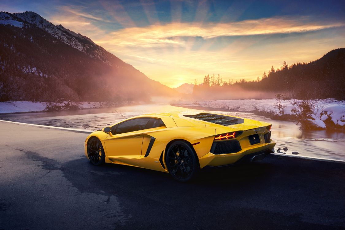 Lamborghini Aventador Amarillo Sobre Arena Gris Cerca Del Cuerpo de Agua Durante el Día. Wallpaper in 2048x1365 Resolution