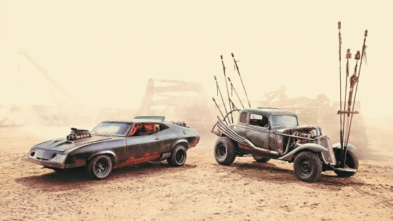 Image black vintage car on brown sand during daytime
