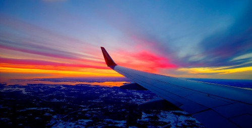 Image white airplane wing during sunset