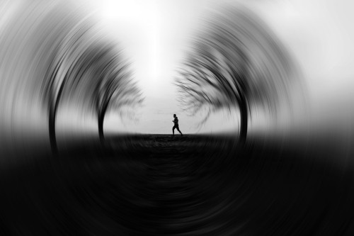 Image silhouette of 2 people walking on road during daytime