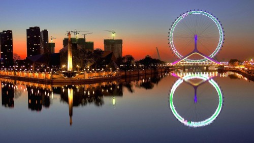 Image ferris wheel near body of water during night time