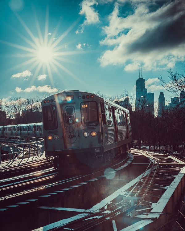 train on rail during daytime