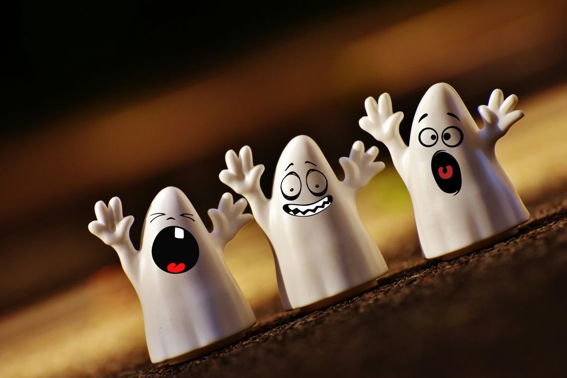 white and black ghost figurines