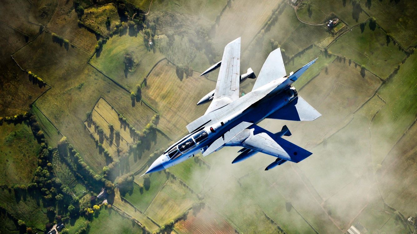 White and Blue Jet Plane Flying Over Green Grass Field During Daytime. Wallpaper in 2560x1440 Resolution