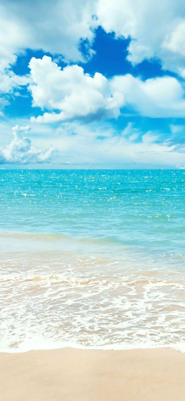 Image blue sea under blue sky and white clouds during daytime