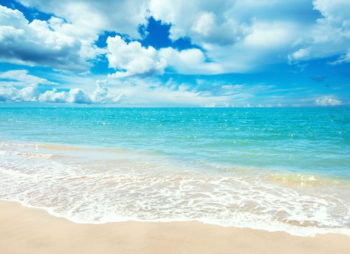 Image blue sea under blue sky and white clouds during daytime