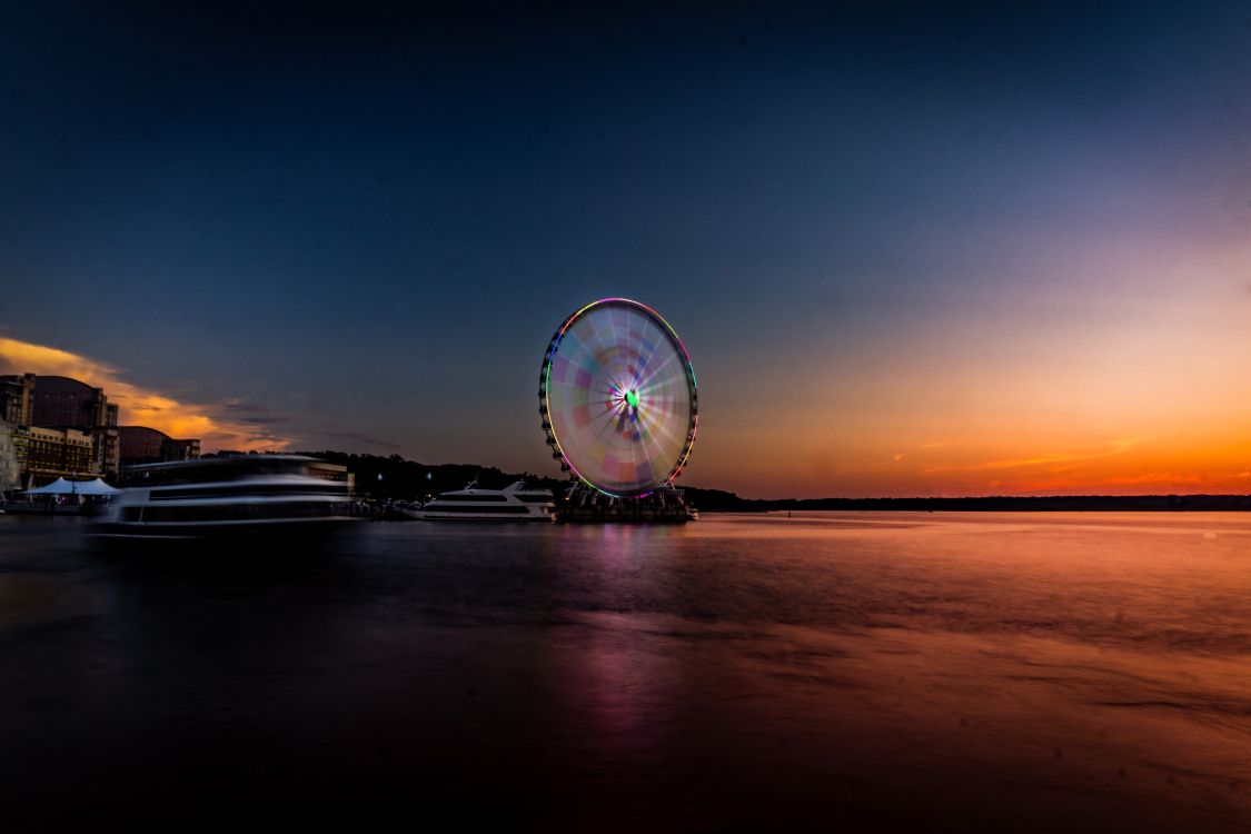 Ferris Wheel Near Body of Water During Night Time. Wallpaper in 6000x4000 Resolution
