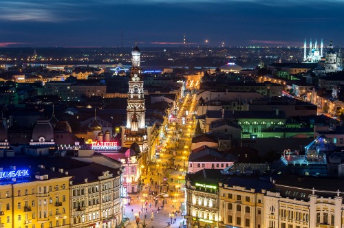 Image yellow lighted tower in the city during night time