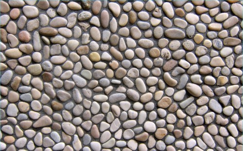 Image brown and gray stones on gray ground