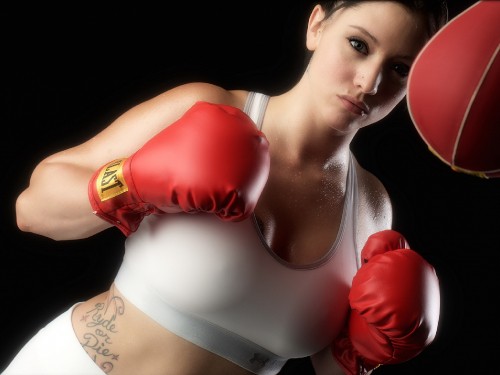 Image woman in red boxing gloves