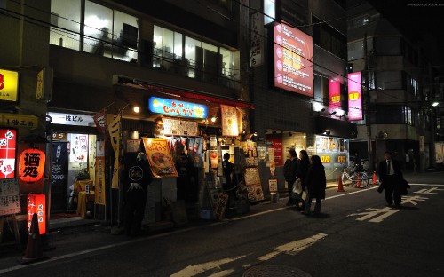 Image people walking on street during nighttime