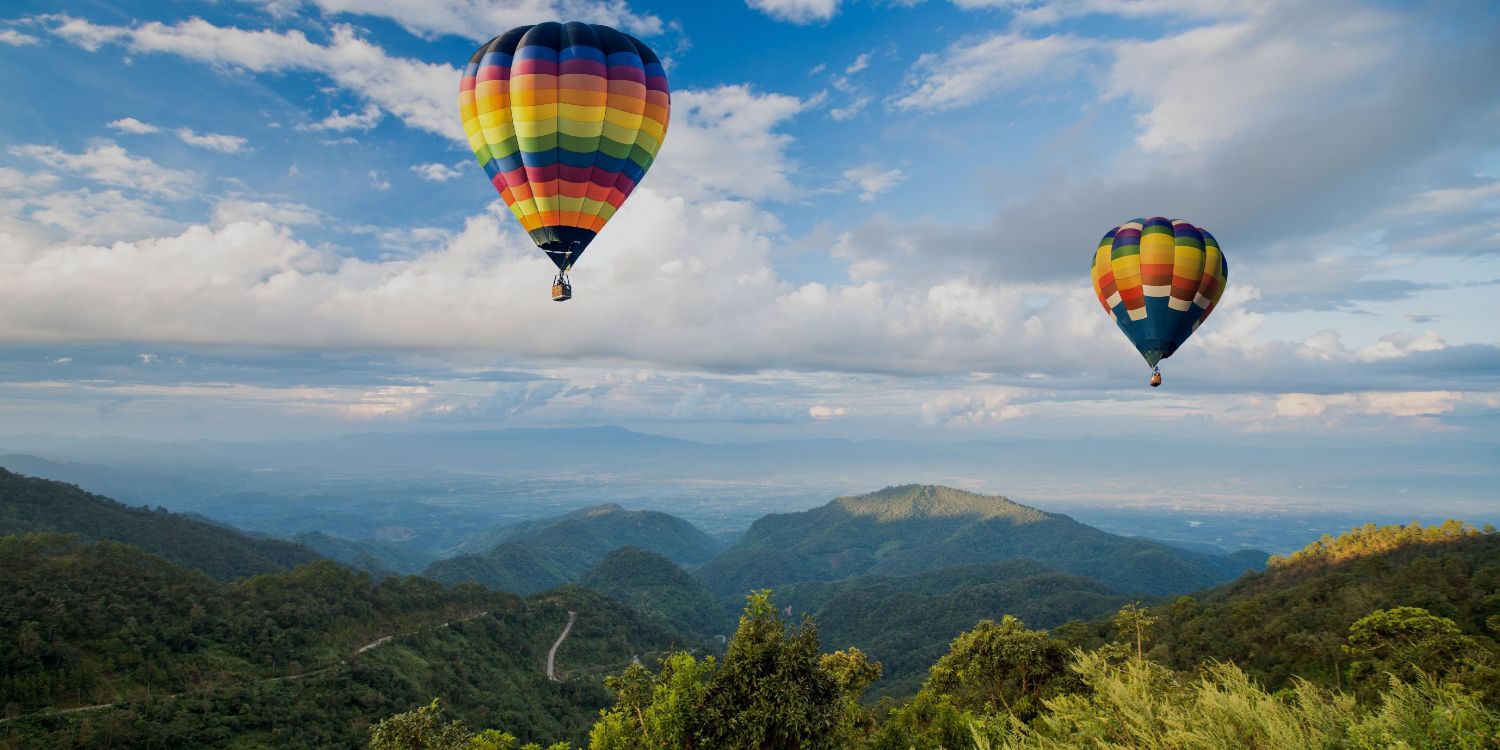 hot air balloon in mid air during daytime