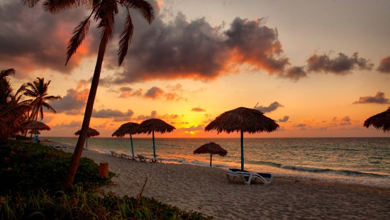 Image beach umbrellas on beach during sunset
