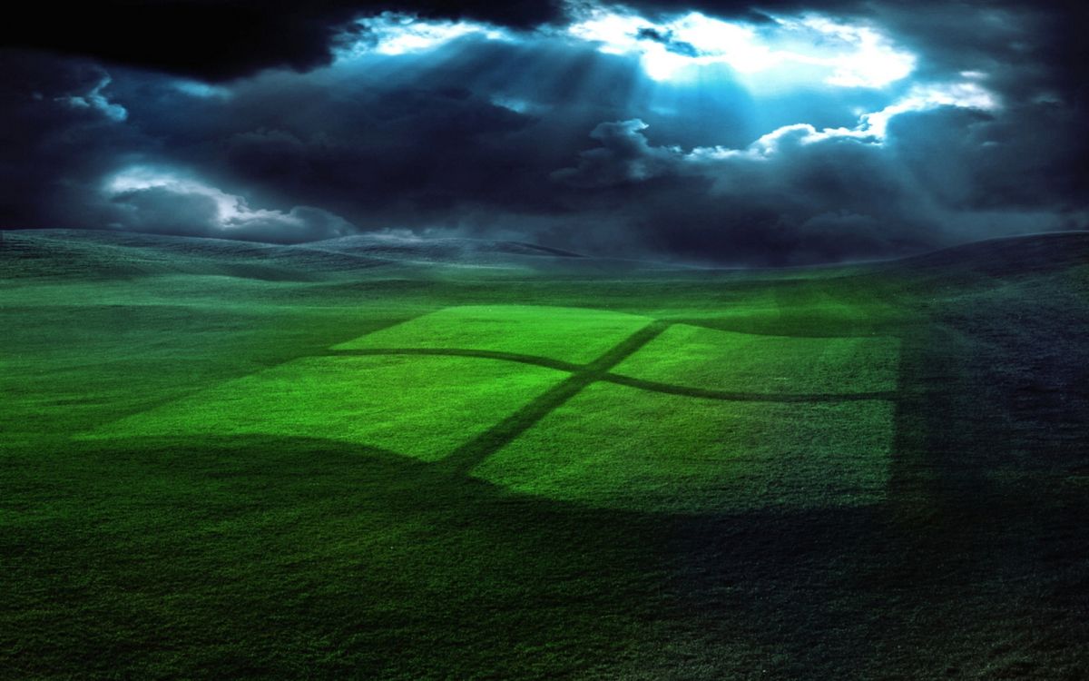 green grass field under white clouds and blue sky during daytime