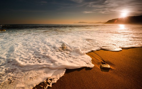 Image ocean waves crashing on shore during daytime