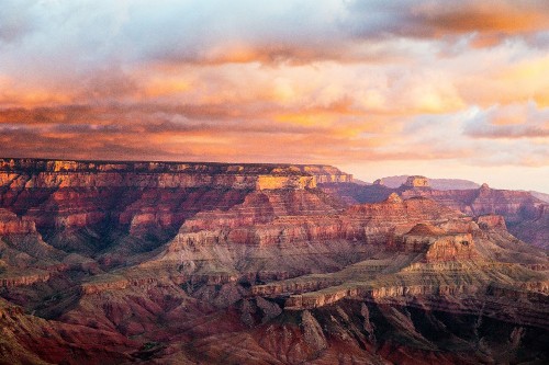 Image brown and black mountains under cloudy sky during daytime