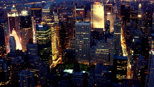 Image aerial view of city buildings during night time