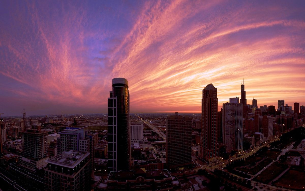 city skyline under cloudy sky during daytime