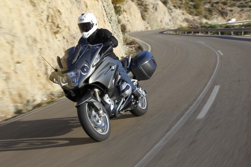 Image man in black helmet riding black sports bike on road during daytime