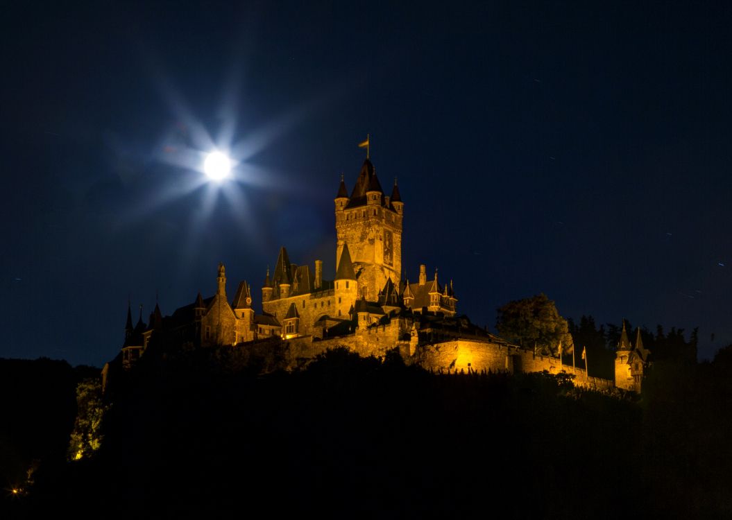 brown castle under starry night