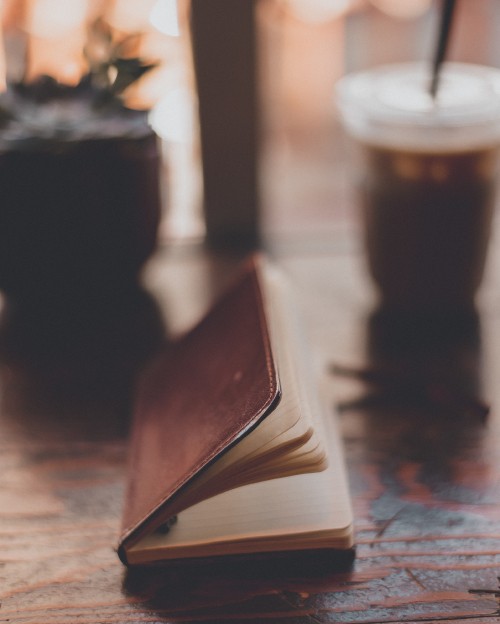 Image brown book on brown wooden table