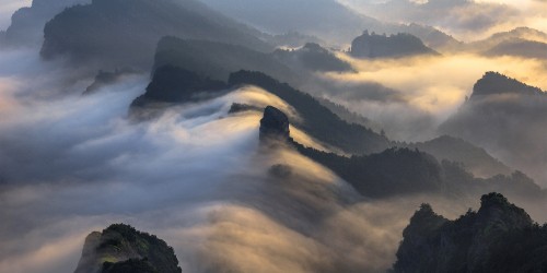 Image green mountains under white clouds during daytime