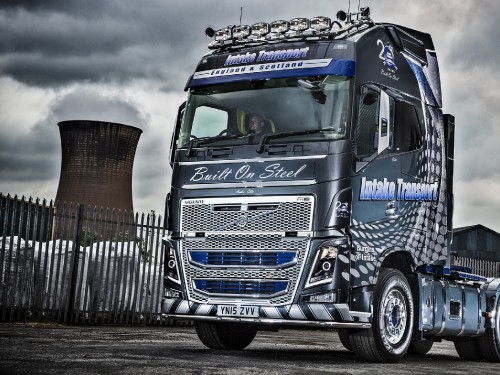 Image blue and white truck on road during daytime