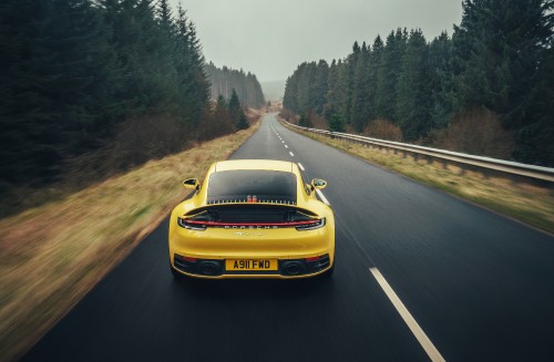 Image yellow porsche 911 on road during daytime