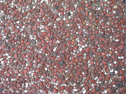 Image red and white stones on ground