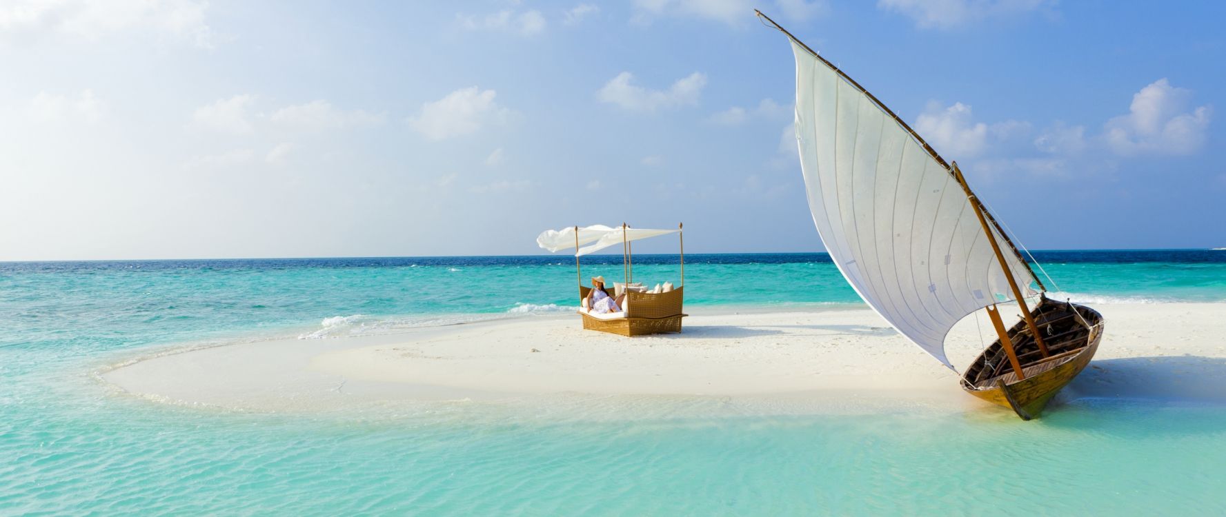 brown boat on sea shore during daytime