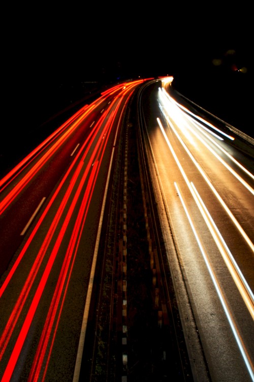 Image time lapse photography of cars on road during night time