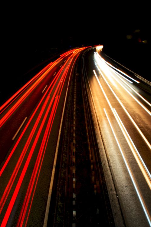 time lapse photography of cars on road during night time