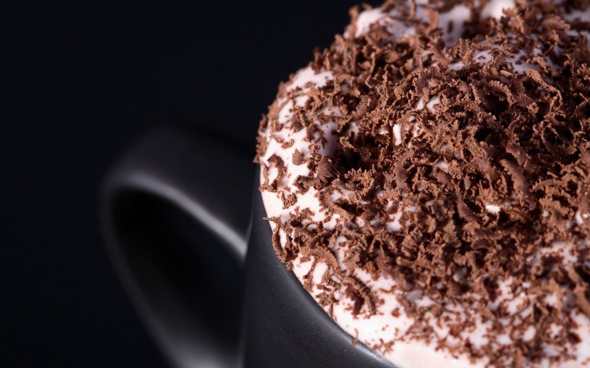 white ceramic mug with brown powder