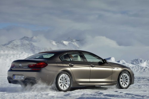 Image silver coupe on snow covered ground