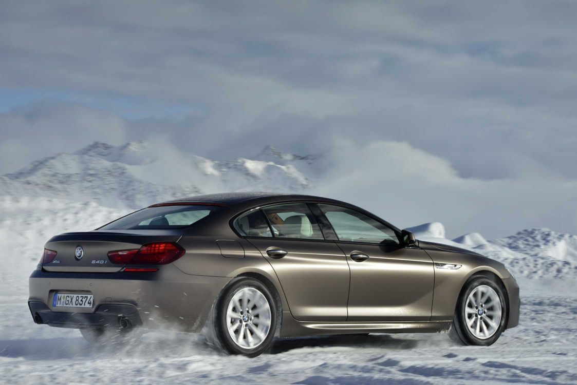 silver coupe on snow covered ground