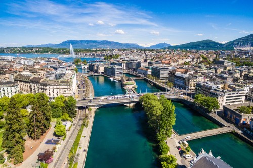 Image aerial view of city buildings and river during daytime