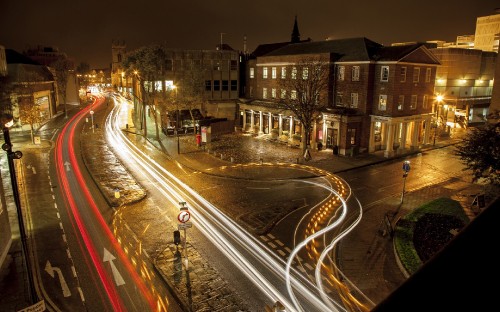Image time lapse photography of cars on road during night time