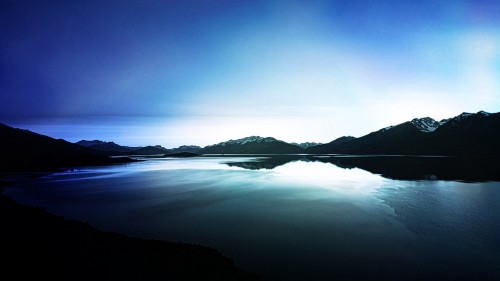 Image body of water near mountain during daytime