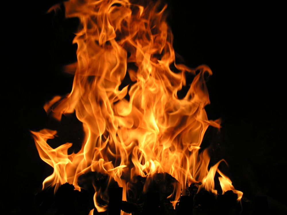 fire in black background with black background