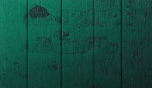 Image green wooden wall with hole